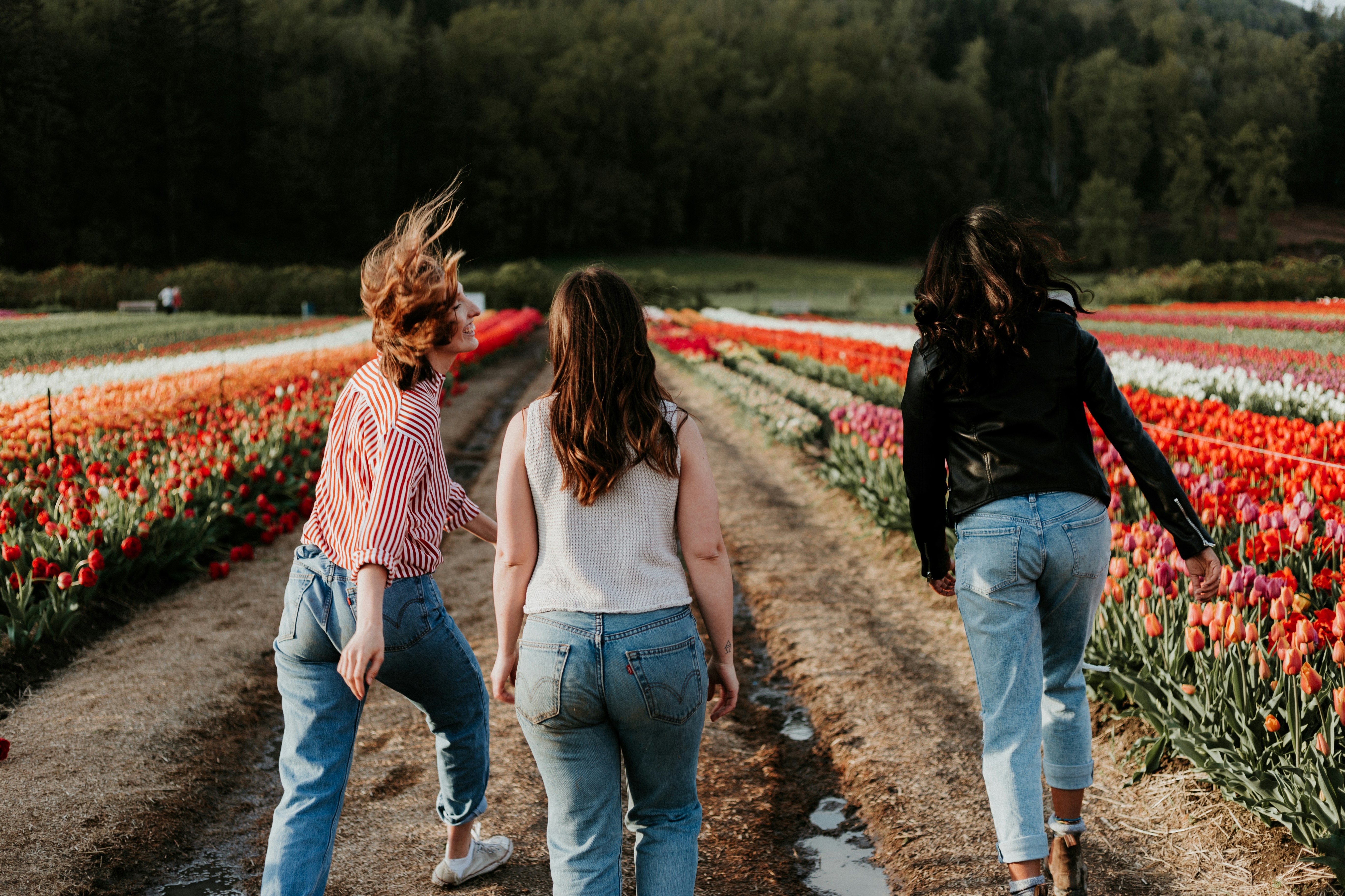 woman in a field walking - Autumn Vs Spring Color Analysis