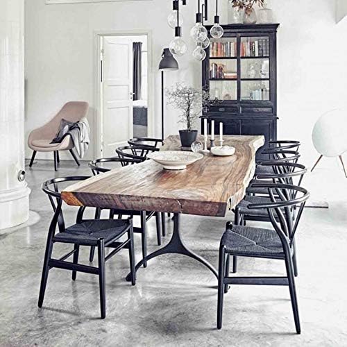 The black wishbone dining chair is a stylish addition that complements any interior design.