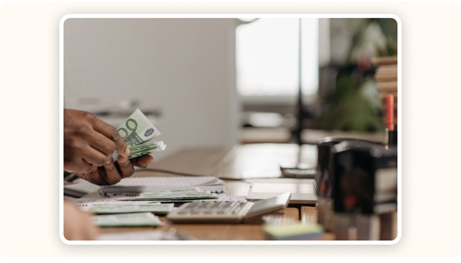 Person counting banknotes