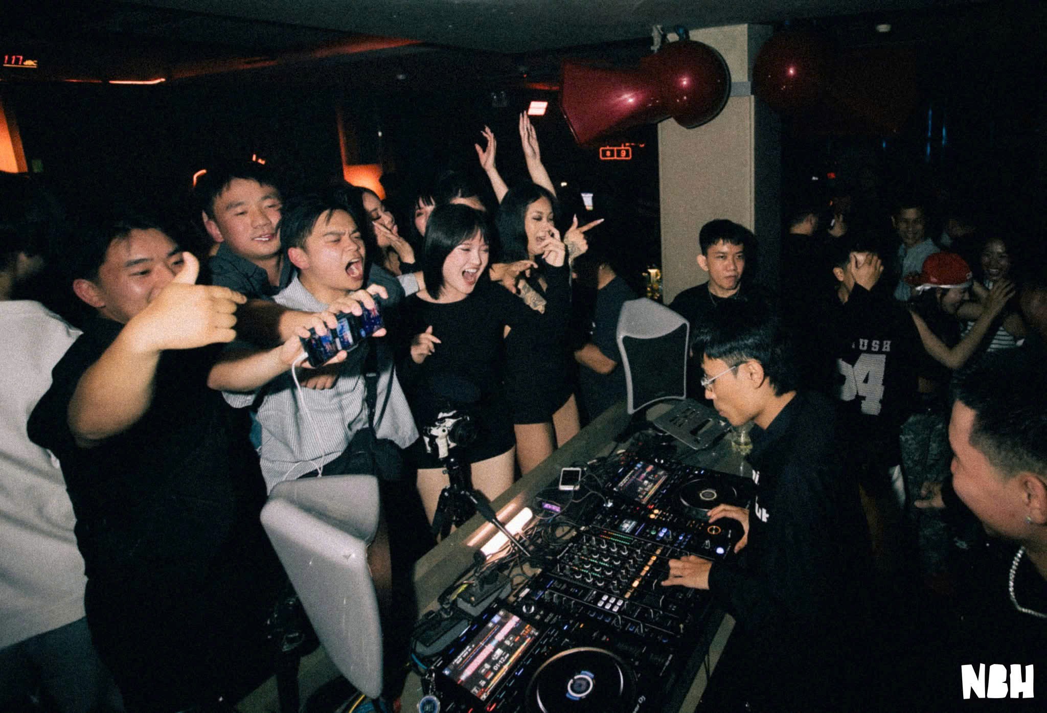 Interior view of Neighborhood SGN on Nam Quốc Cang, District 1, showing the packed nightclub floor