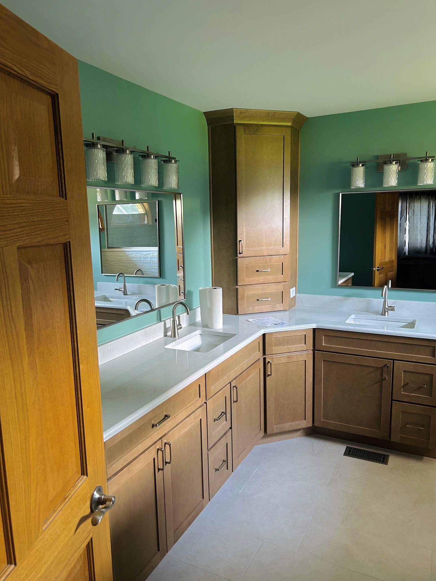 Modern bathroom renovation with natural wood vanity