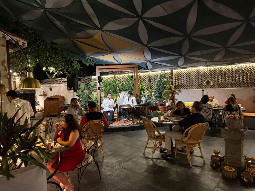 Ambient handpan and flute live performance at Santé Spa Cuisine Pune with guests enjoying an intimate dining atmosphere
