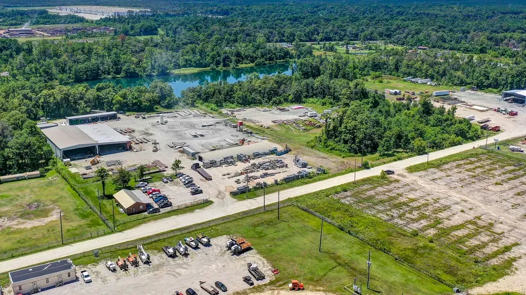 birds flying above white and gray house during daytime