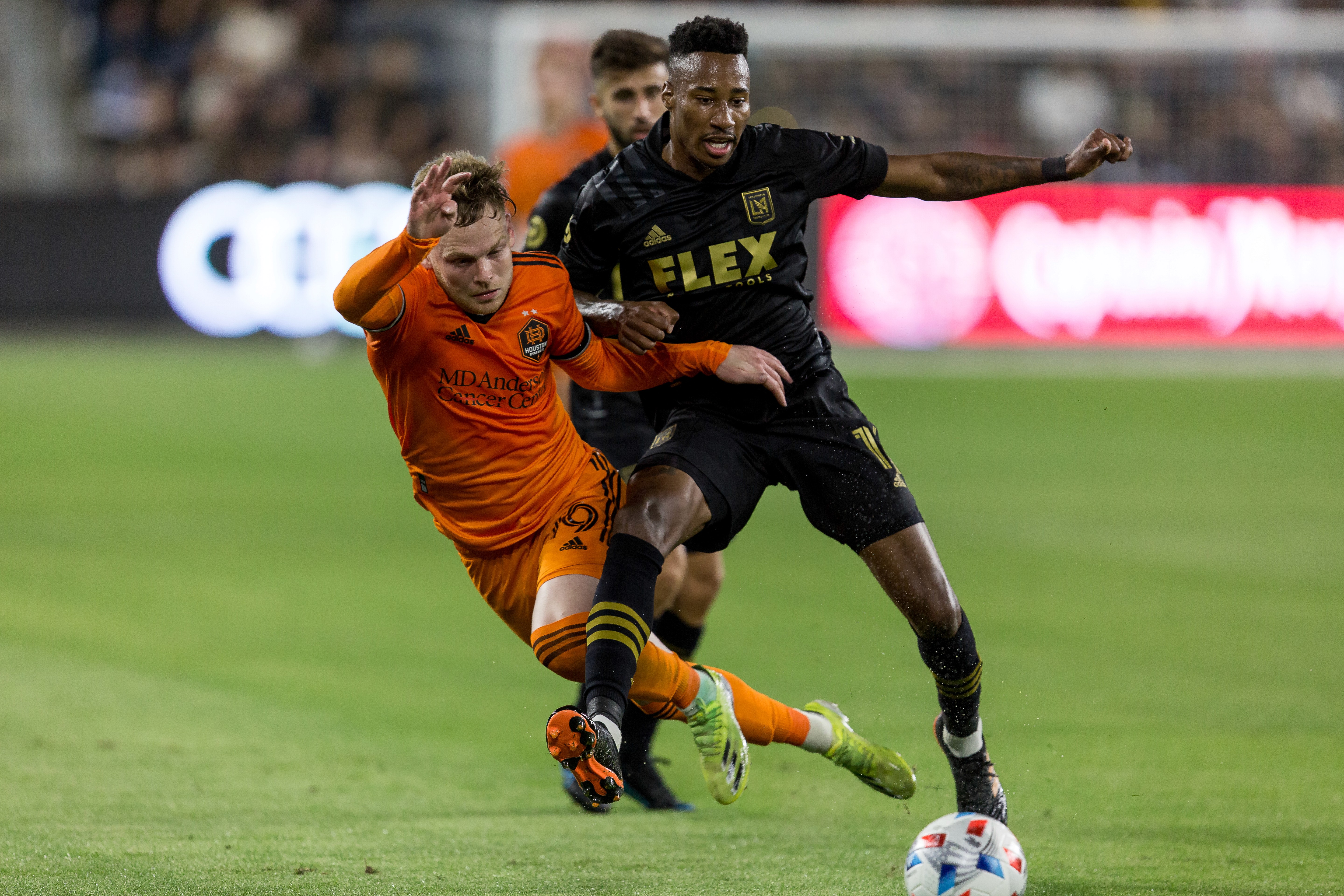 Mark-Anthony Kaye winning the ball during LAFC match game day photos taken by Johnny Baru Media on assignment for Urban Pitch in Los Angeles CA