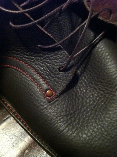 A photo of a green leather shoe.