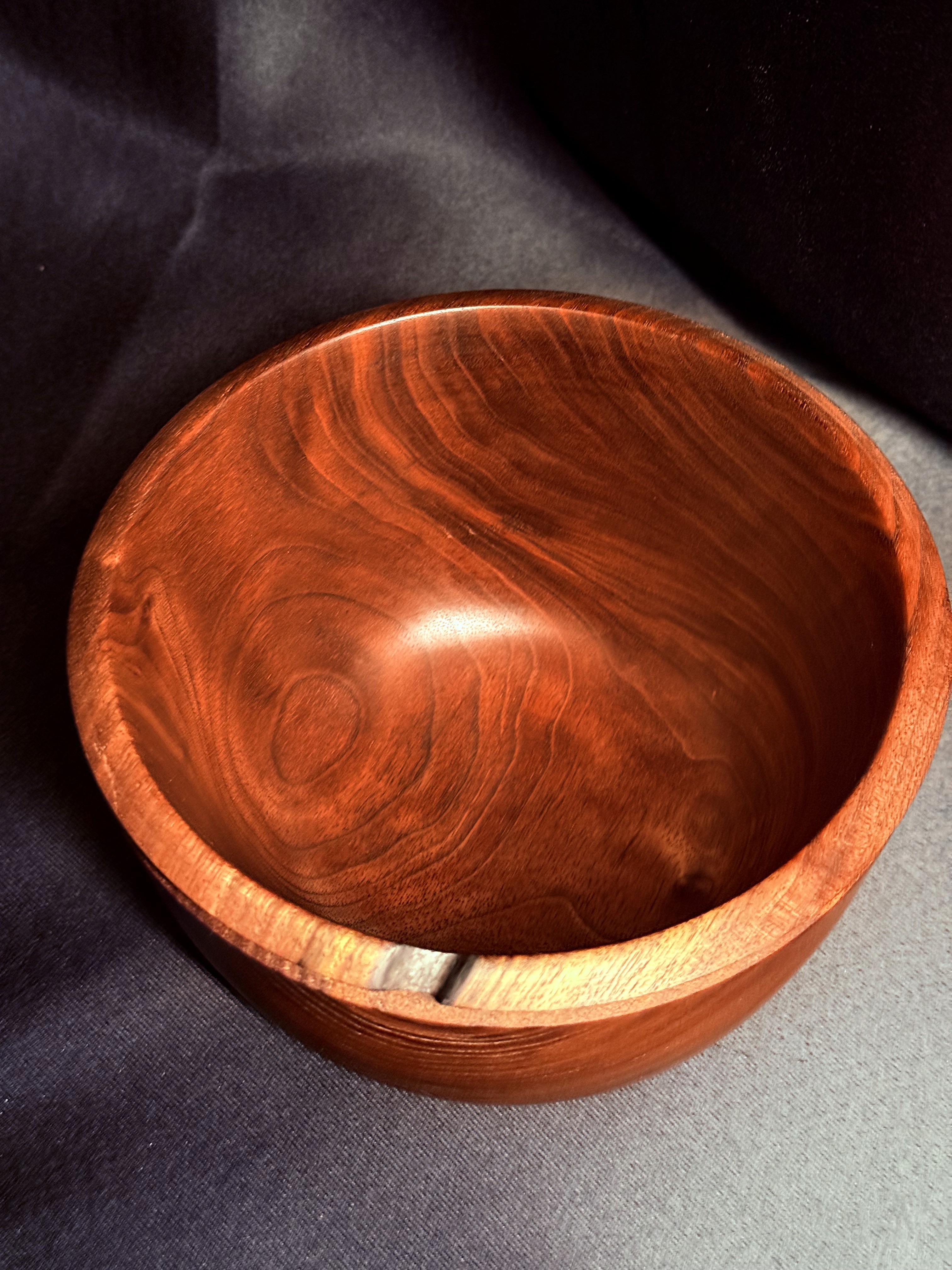 Supporting view of the Fire-Scarred Walnut Bowl, showing its natural rim detail.