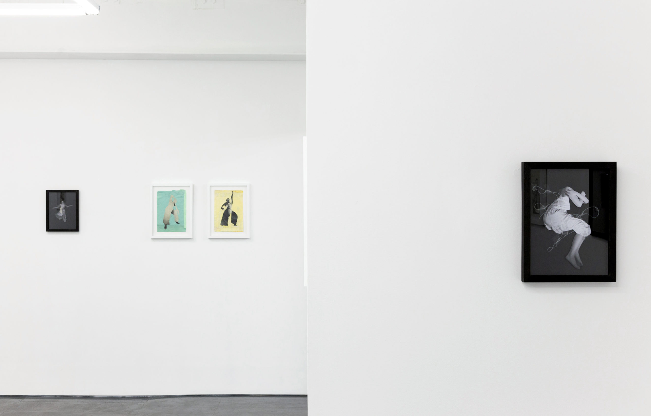 exhibition wall with hanged prints