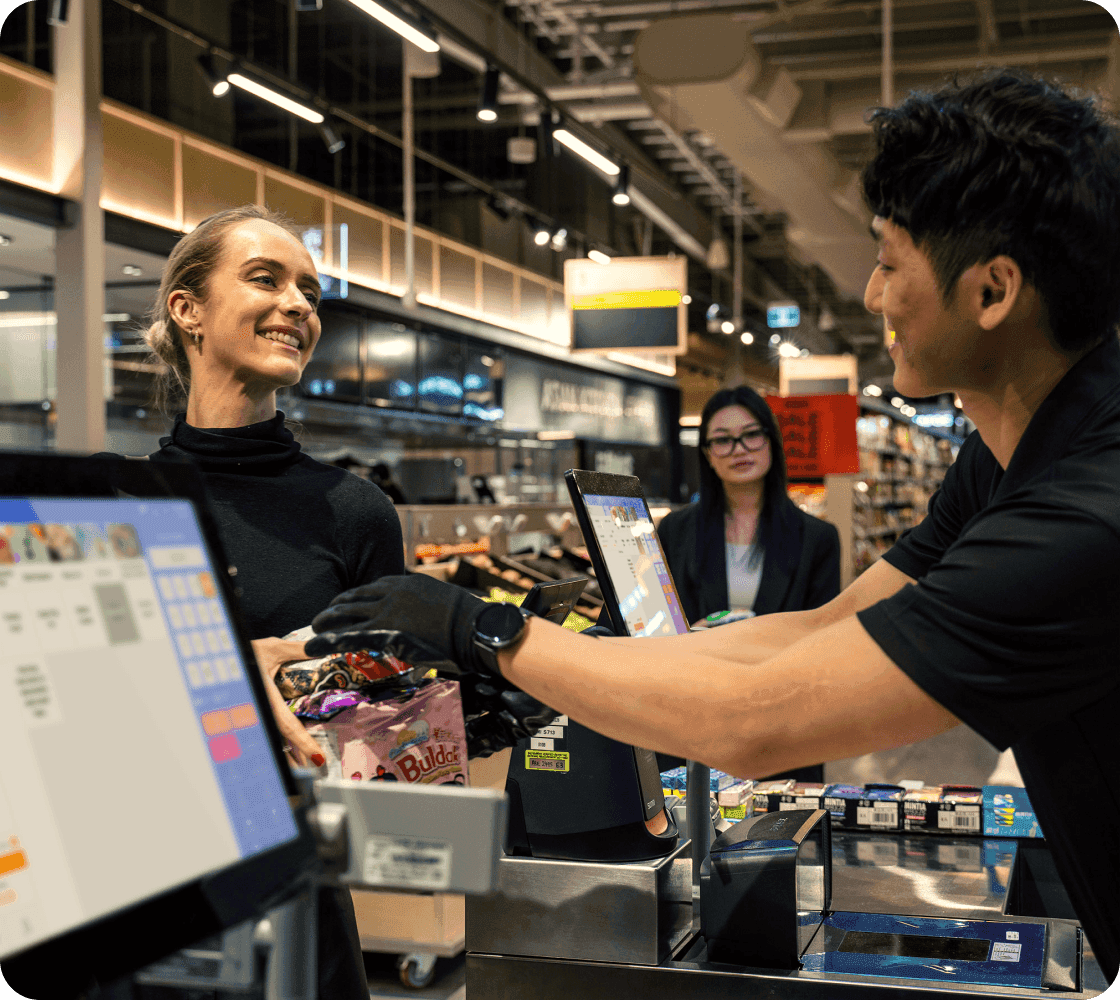 cashier use grocery pos system in supermarket