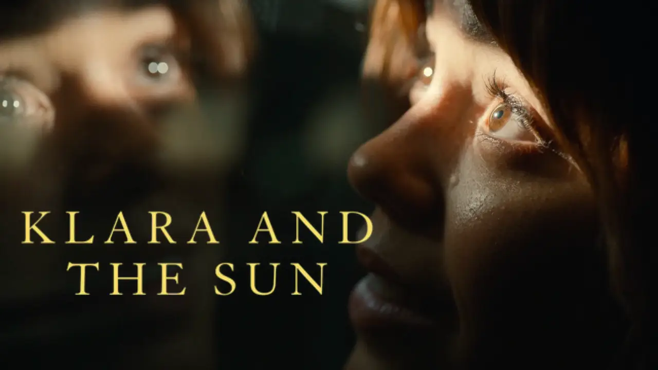 A close-up image of a person's face is partially illuminated by sunlight, with the reflected title "Klara and the Sun" prominently displayed alongside.
