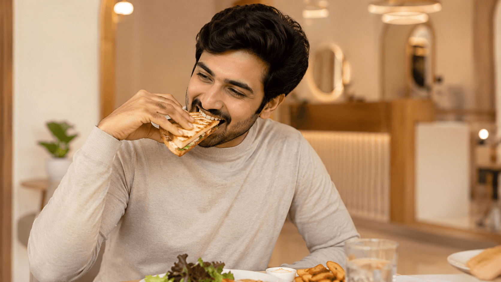 A patient enjoying a meal, representing the functional restoration of their bite.