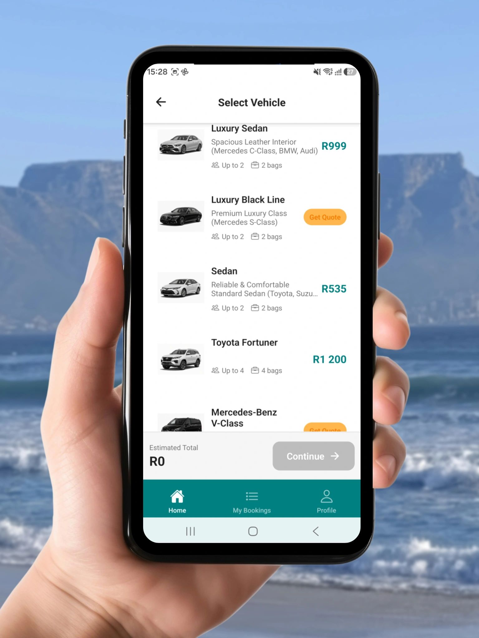 SureCape booking app open on a phone in front of Table Mountain
