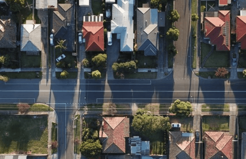 Aerial view of a suburban neighborhood with houses and streets.