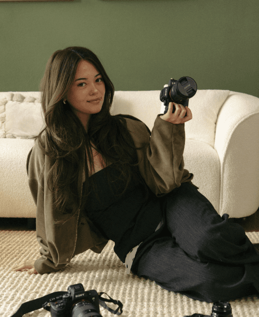 Portrait of a person in dark clothing speaking on a phone