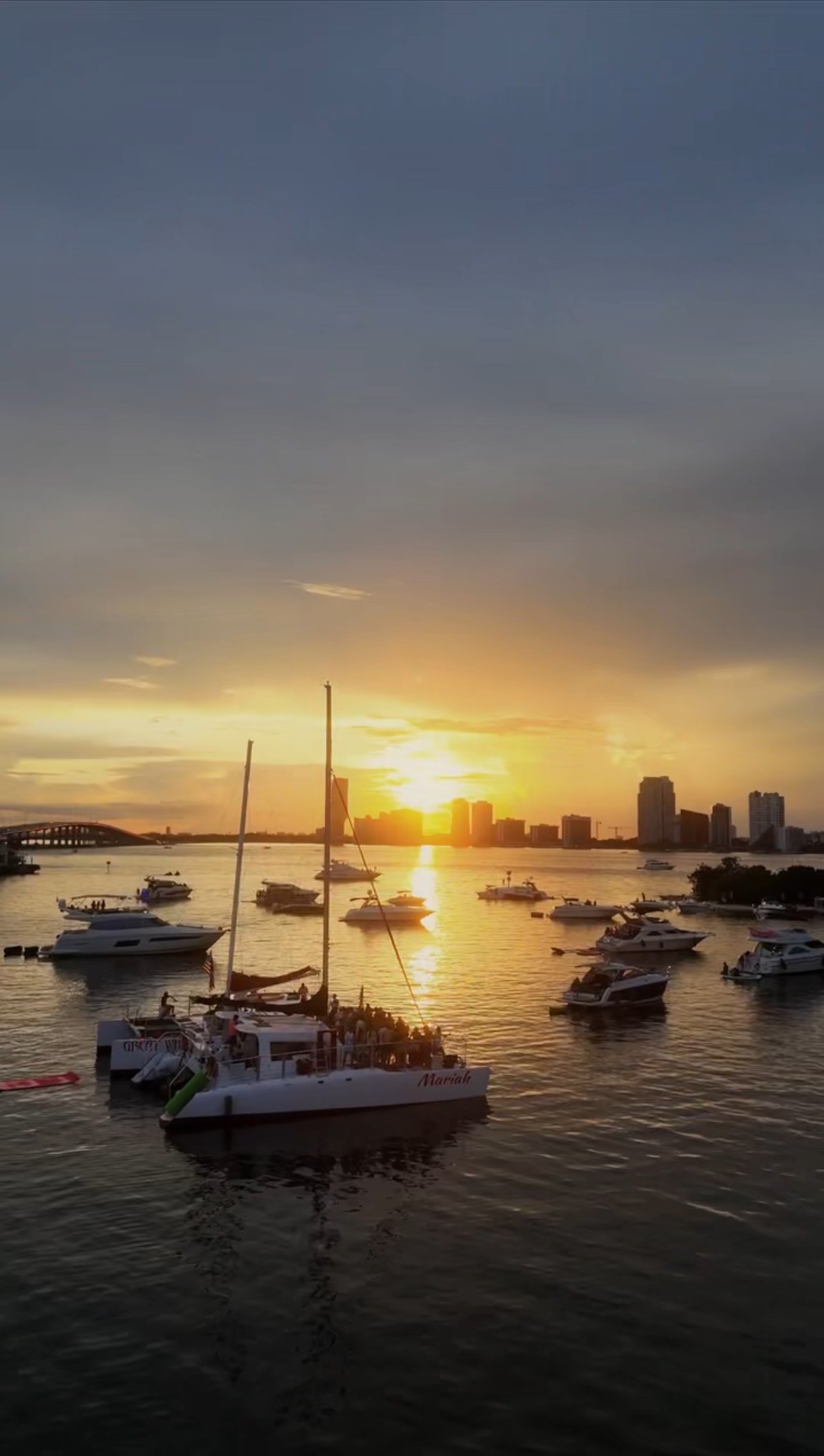 a couple of people standing on top of a mountain