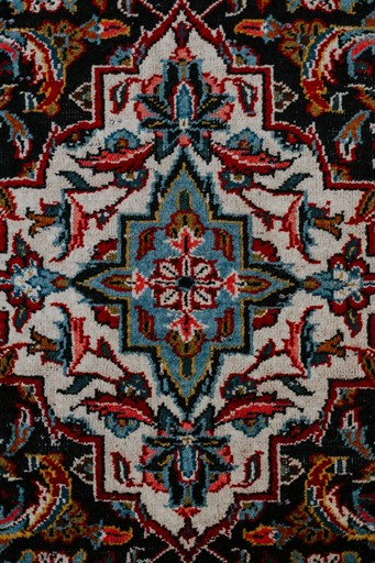 red white and black floral textile