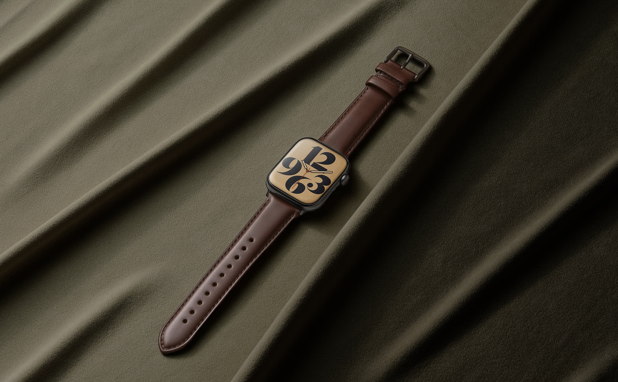 Modern smartwatch with brown leather strap on green fabric background