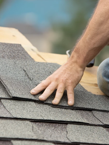 closeup of roofer working