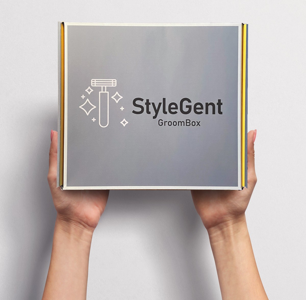 A fluffy gray rabbit rests on a floral chair.