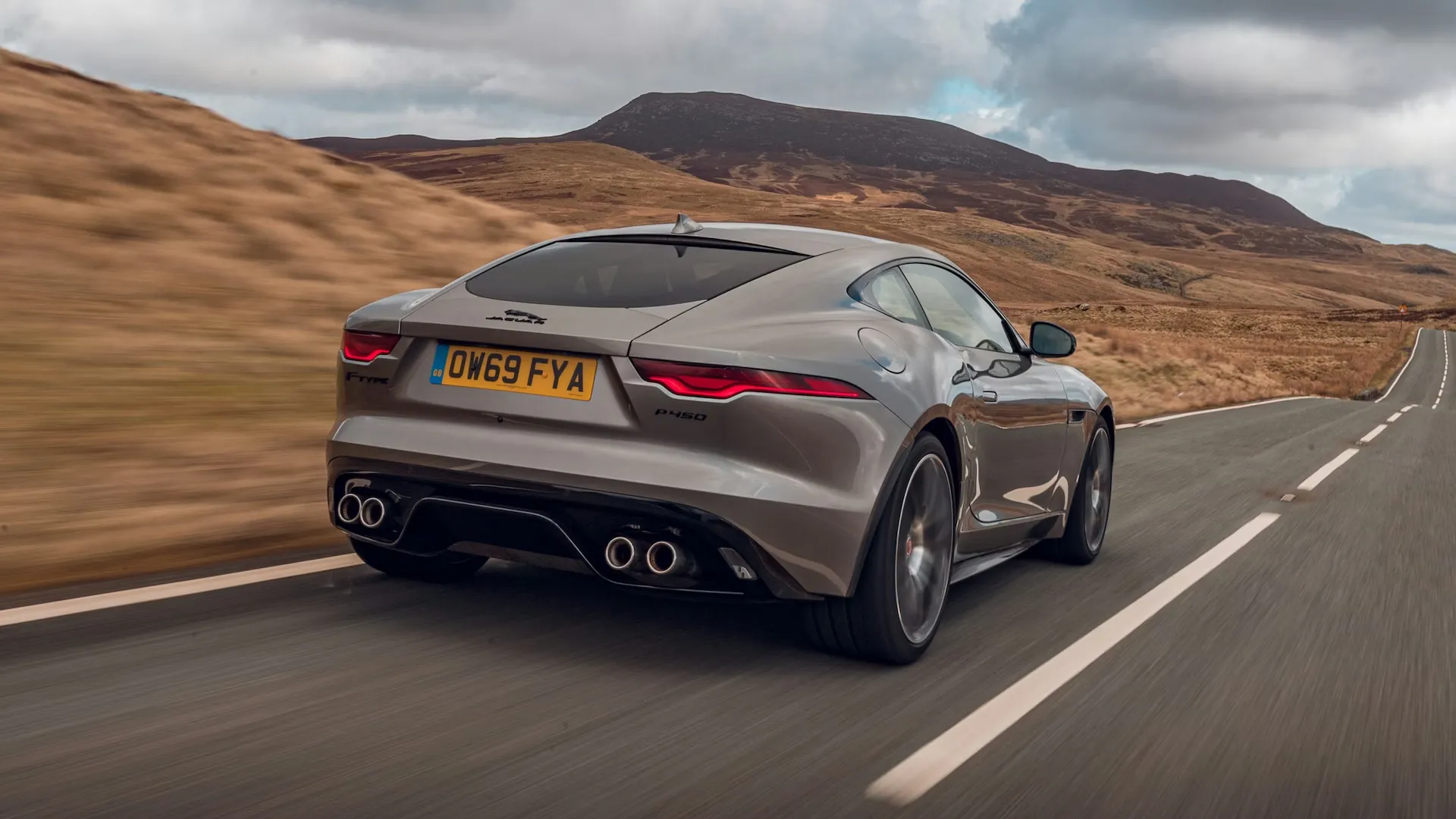 Grey coupe, rear three-quarter