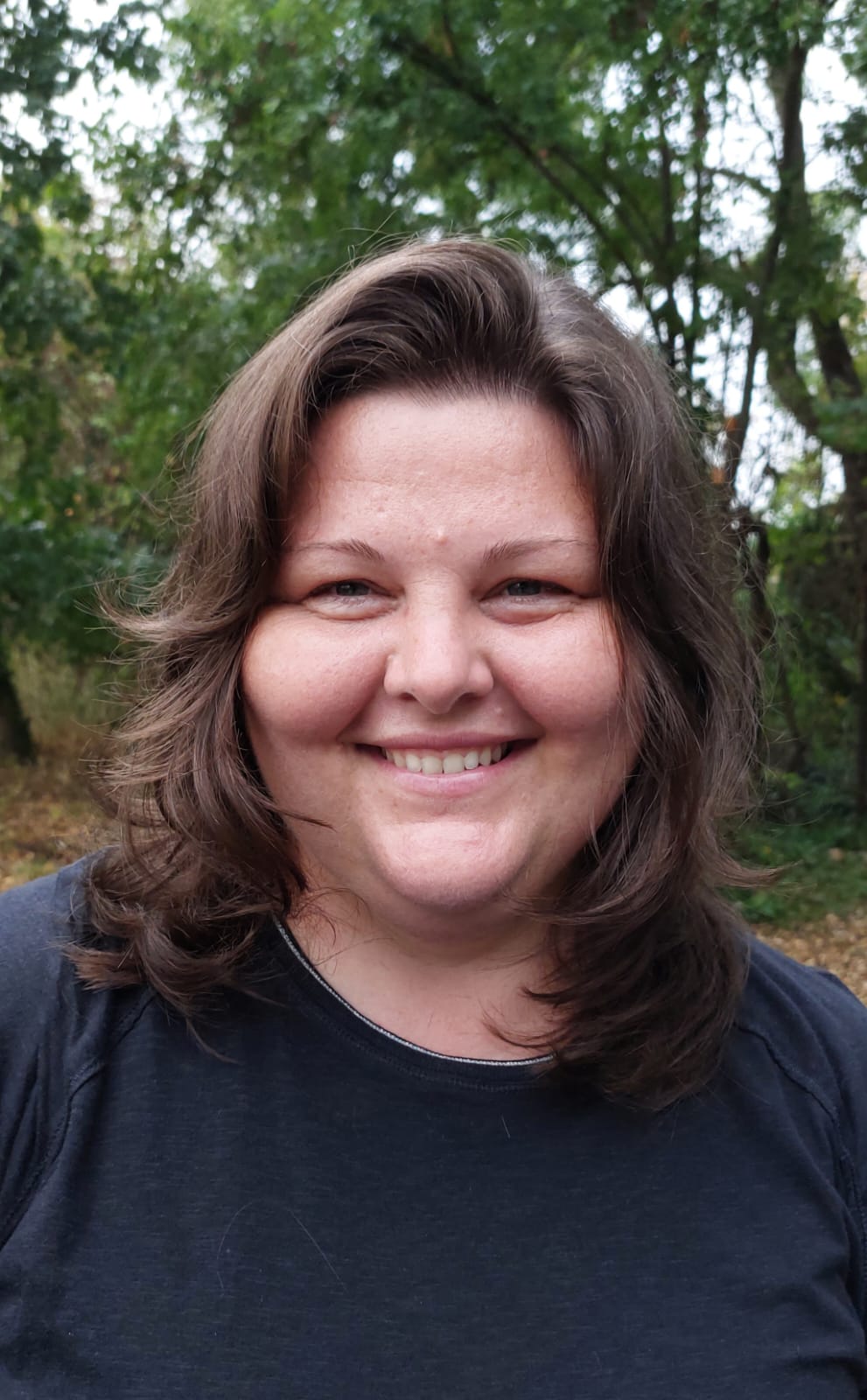 man in yellow hoodie wearing black knit cap