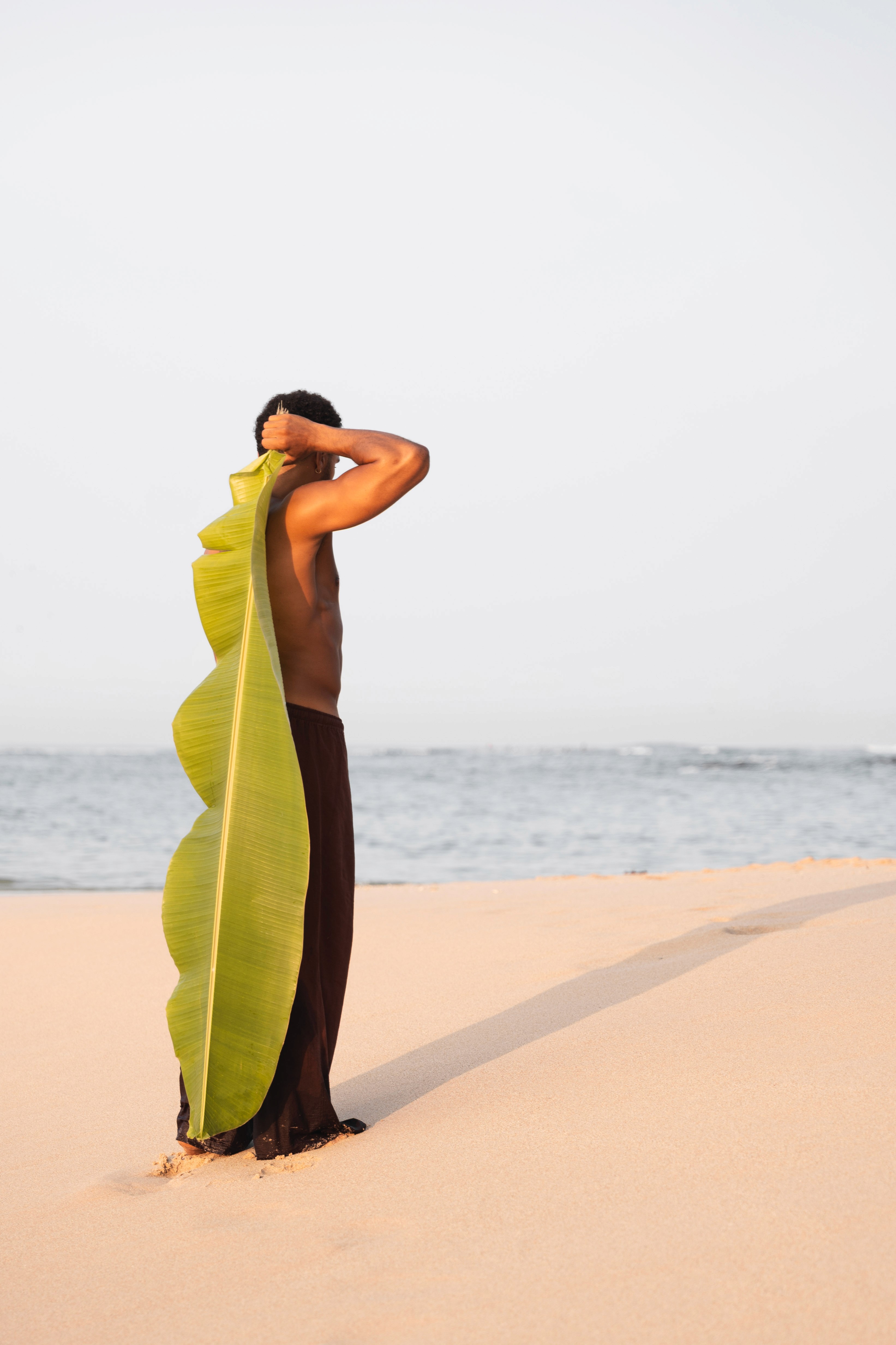 Beach with some blurry legs in the front 