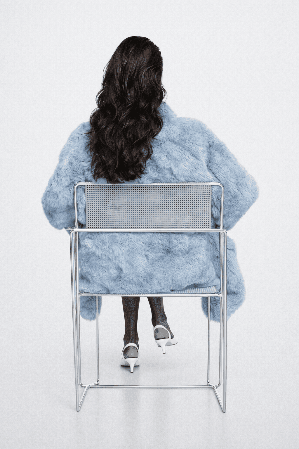 Professional headshot of a person in a formal setting.