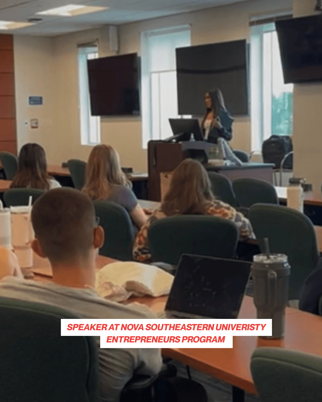 A black and white studio portrait of a woman.