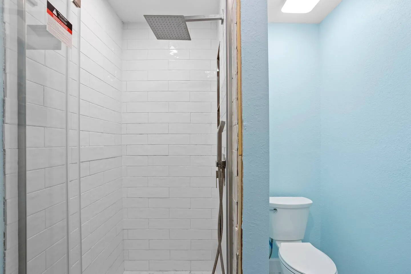 Bath with walk-in rain shower at Pickleball Resort, Bradenton, Florida