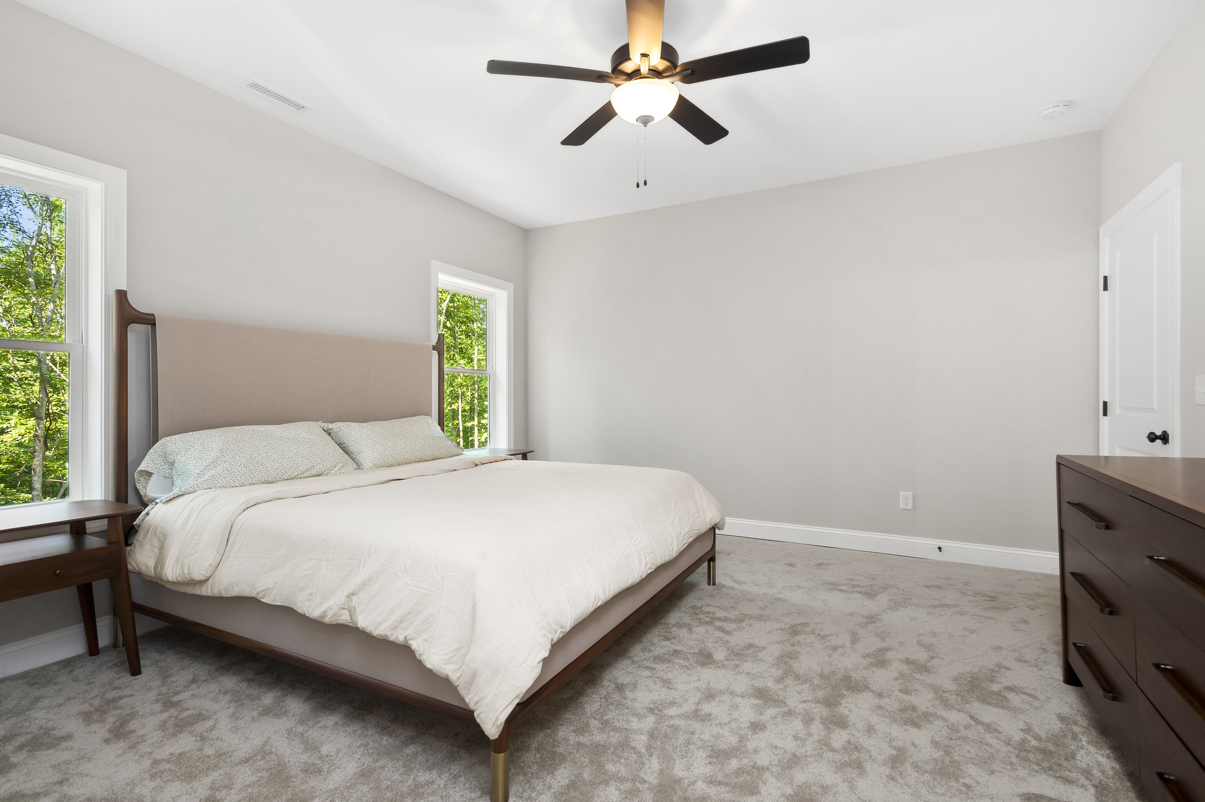 Open concept kitchen and living room with vaulted ceilings and hardwood floors