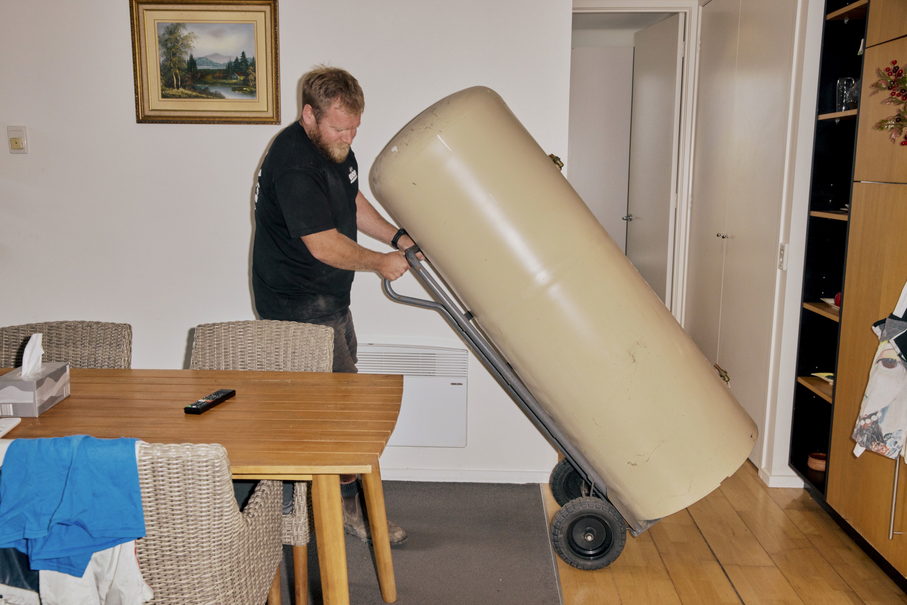 Good Maintenance Plumber repairing a Everhot hot water system