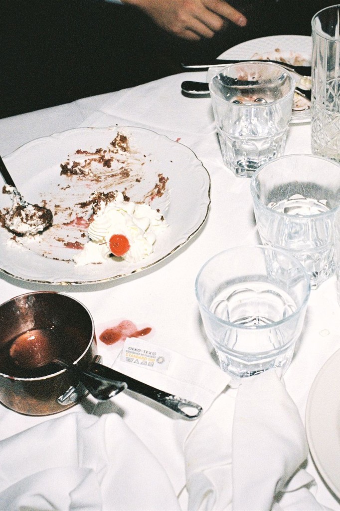 Detail flash shot of table with remnants of the dessert