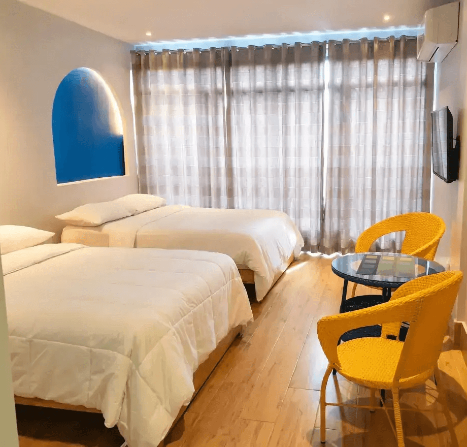 Spacious Family Room with two beds and pool access at Oktowaves Hotel Nasugbu