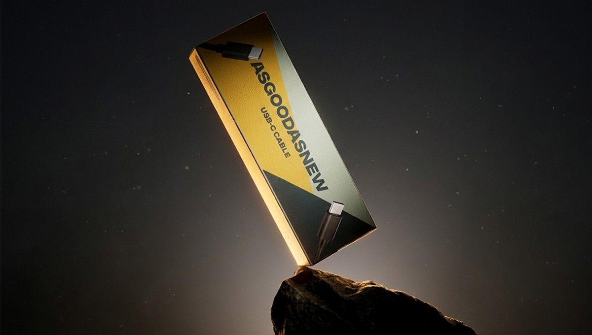 Family standing in a lush green field with tractor.