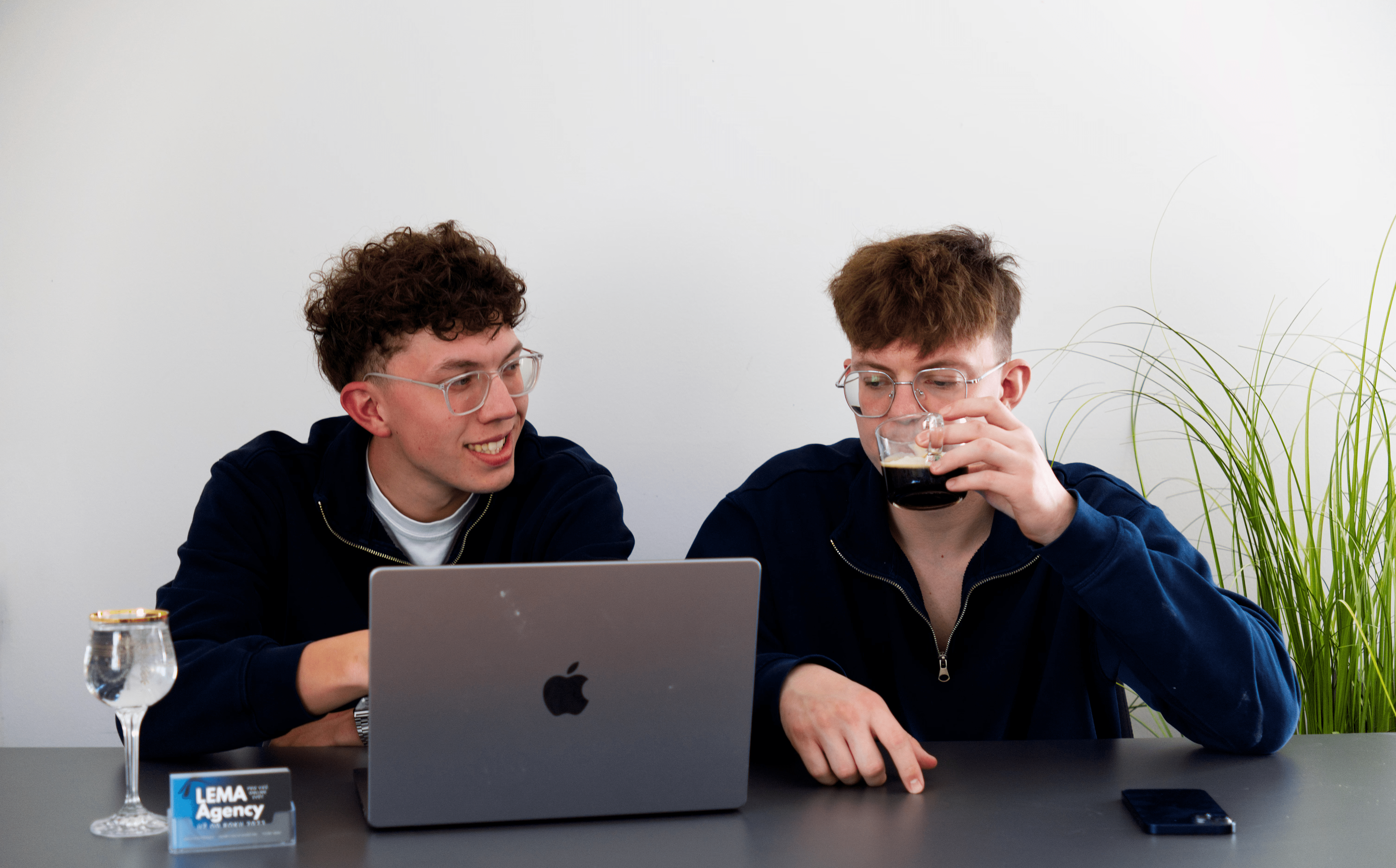 Woman with headphones smiling serenely in warm sunlight