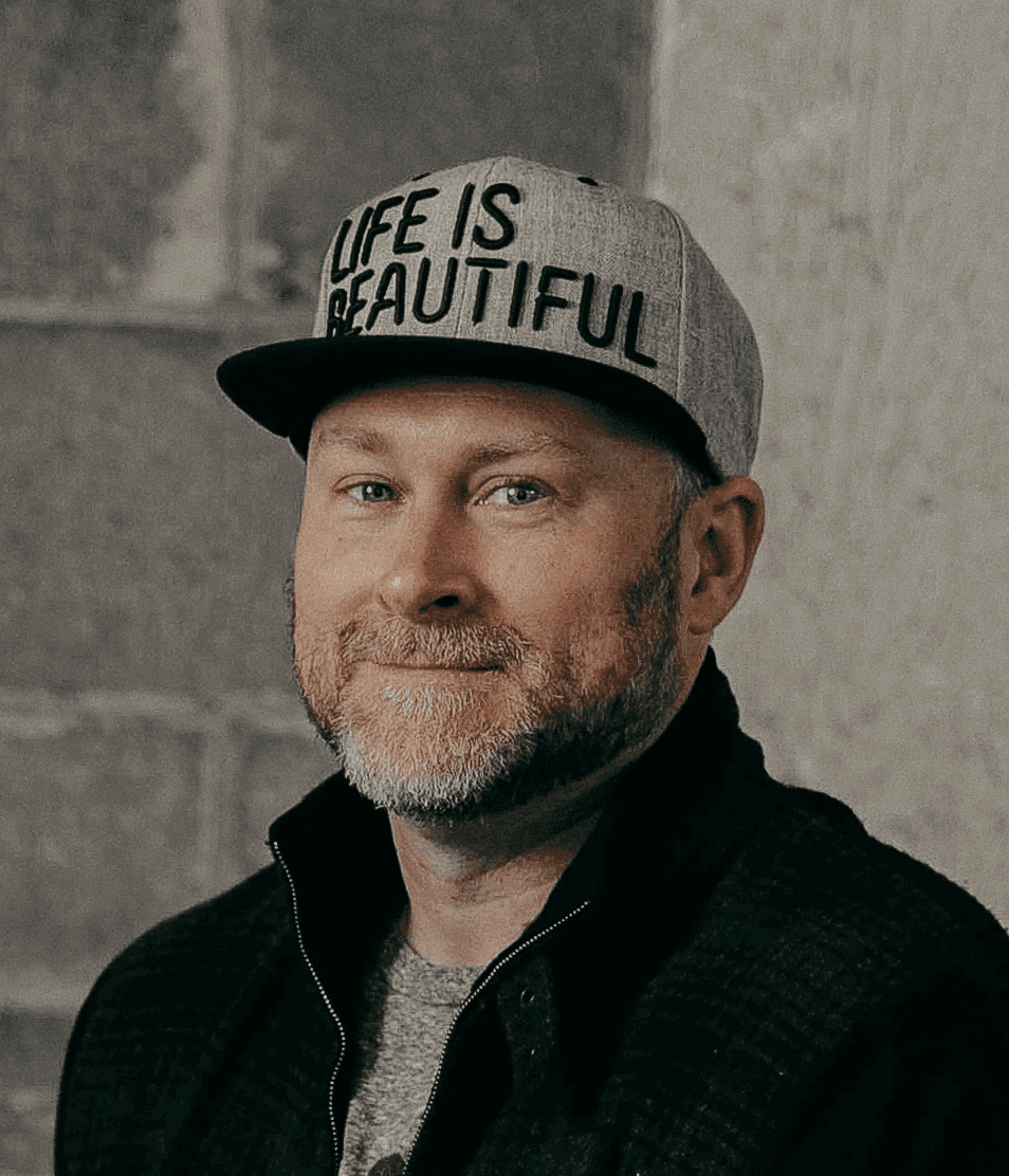 Portrait of Patrick Haney wearing a Life is Beautiful hat