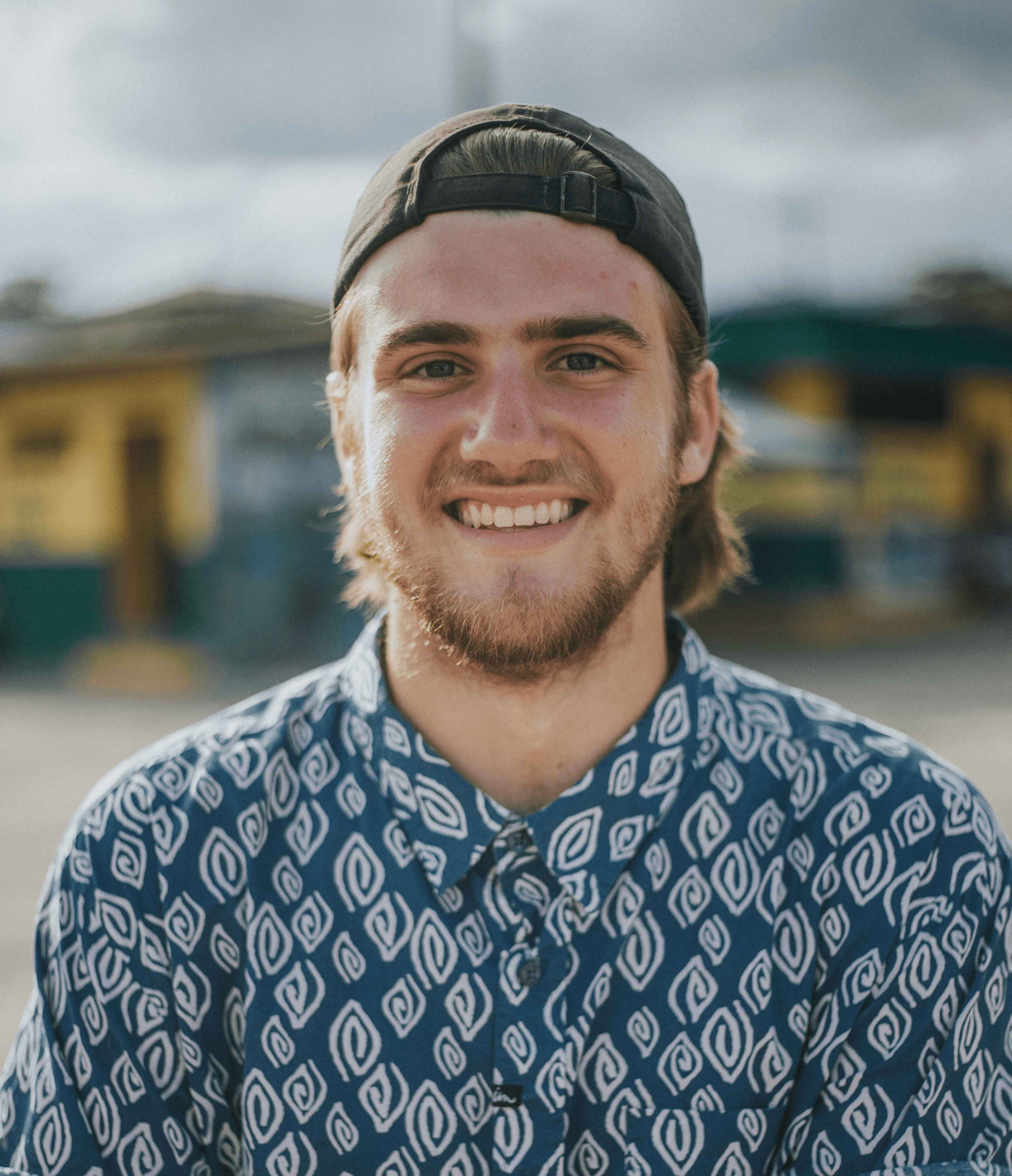 person wearing blue top smiling