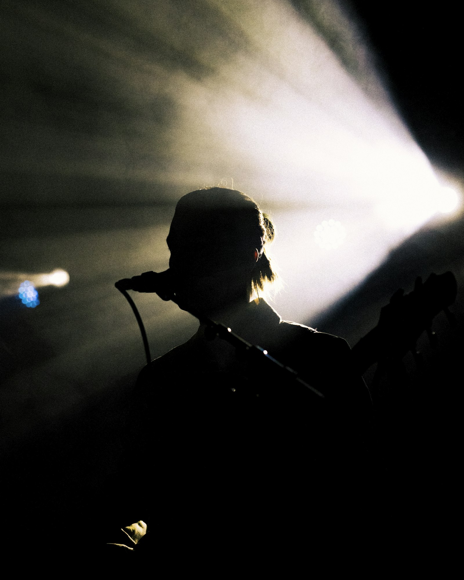 A single spotlight on a dark stage, representing focused attention