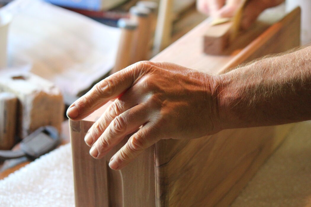 brown and white concrete house near green trees during daytime