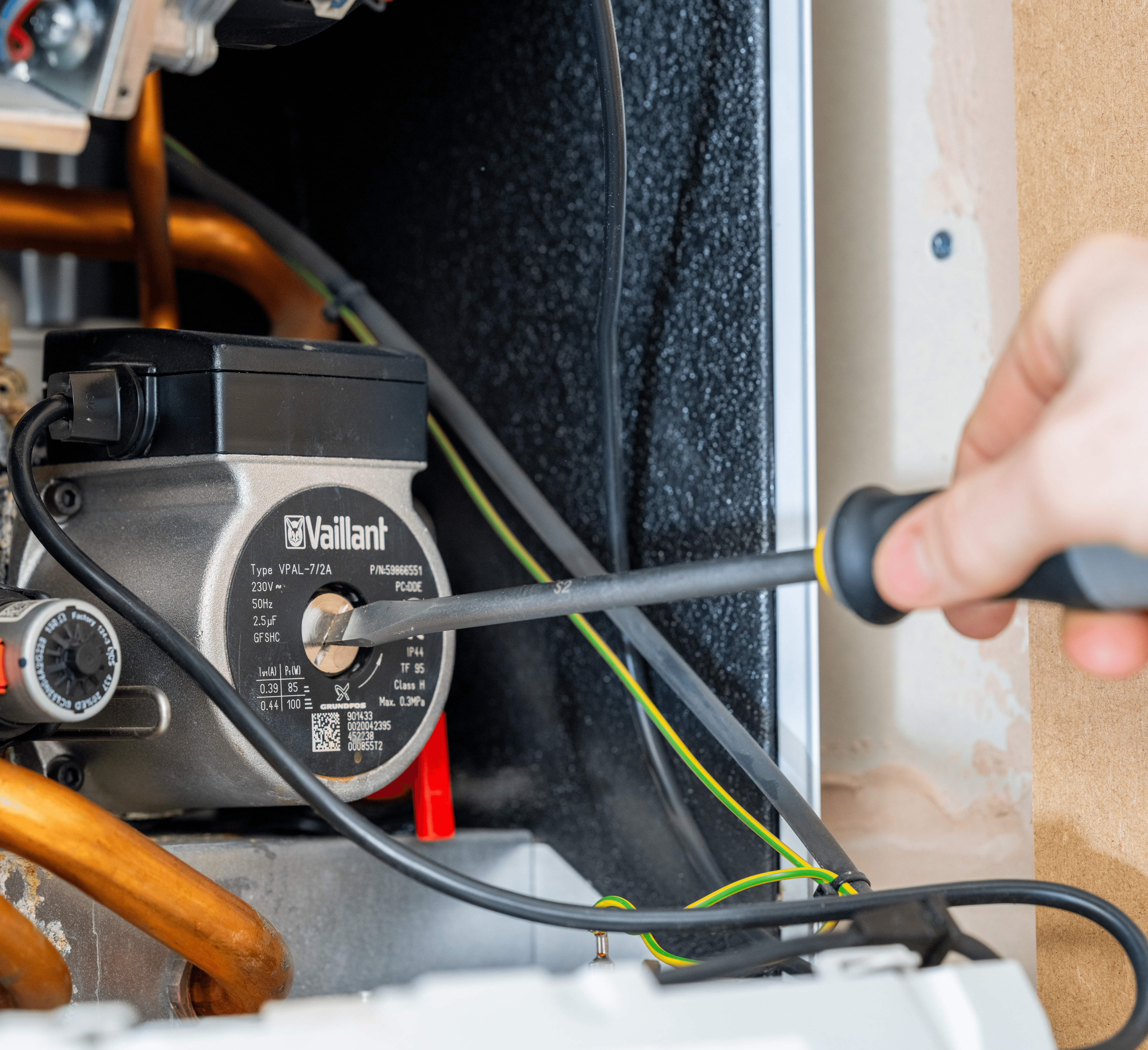 Gas safe engineer carrying out a boiler repair in north london