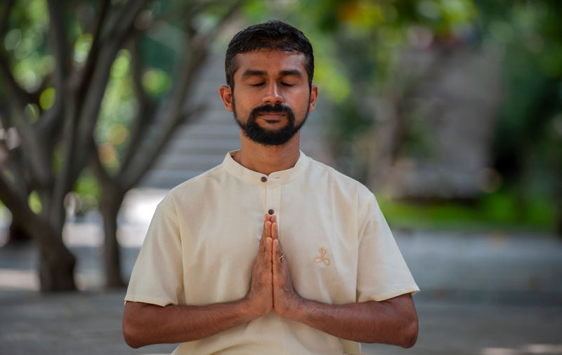Professional headshot of a person in a formal setting.