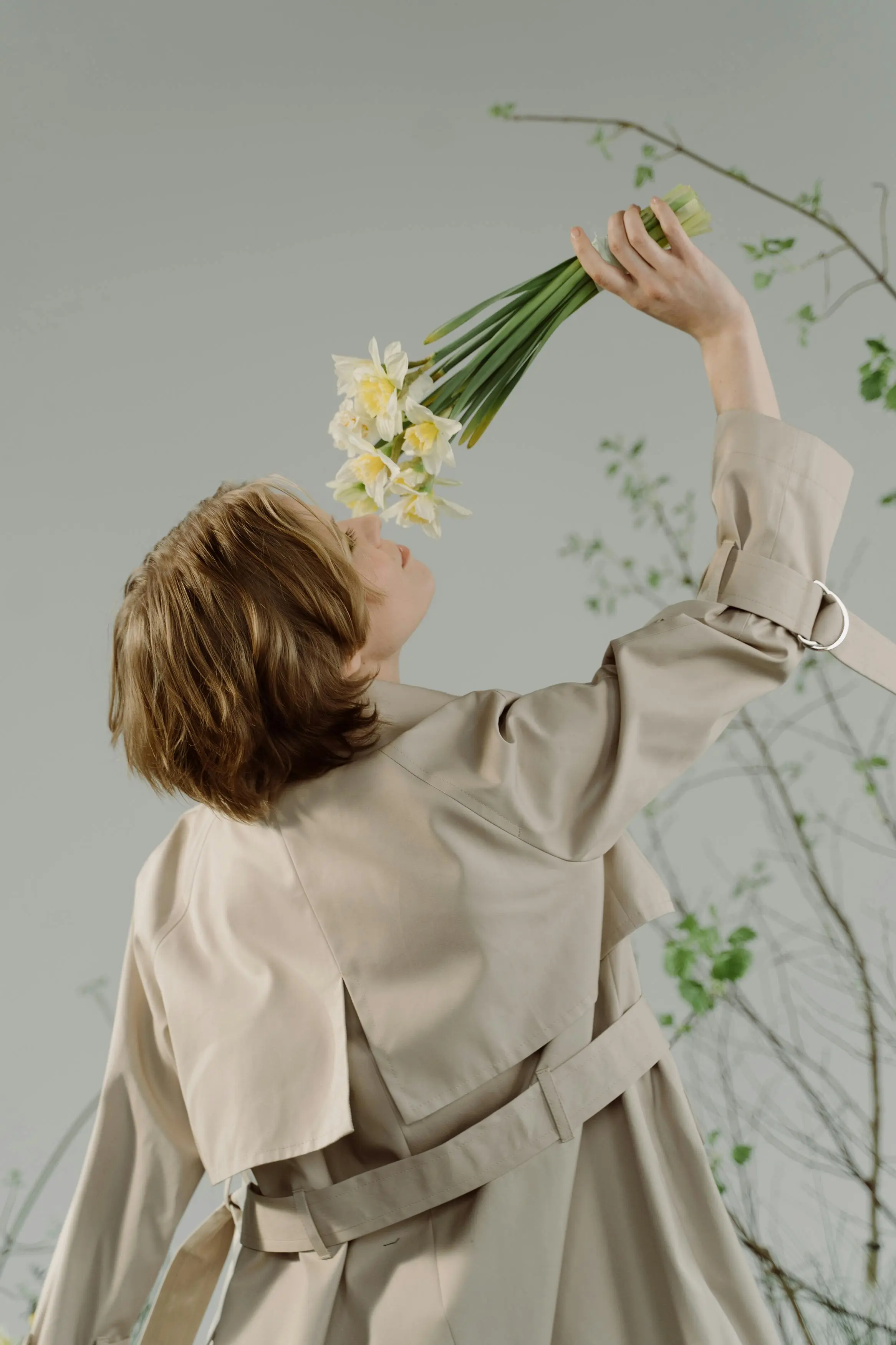 Sophia Reynolds is posing with flowers