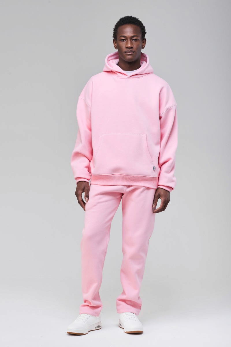 Sunday Superior Mercer Boxy Fit Hoodie in soft pink, male model front view