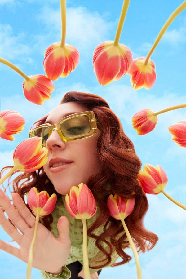 close-up image of a woman with petals