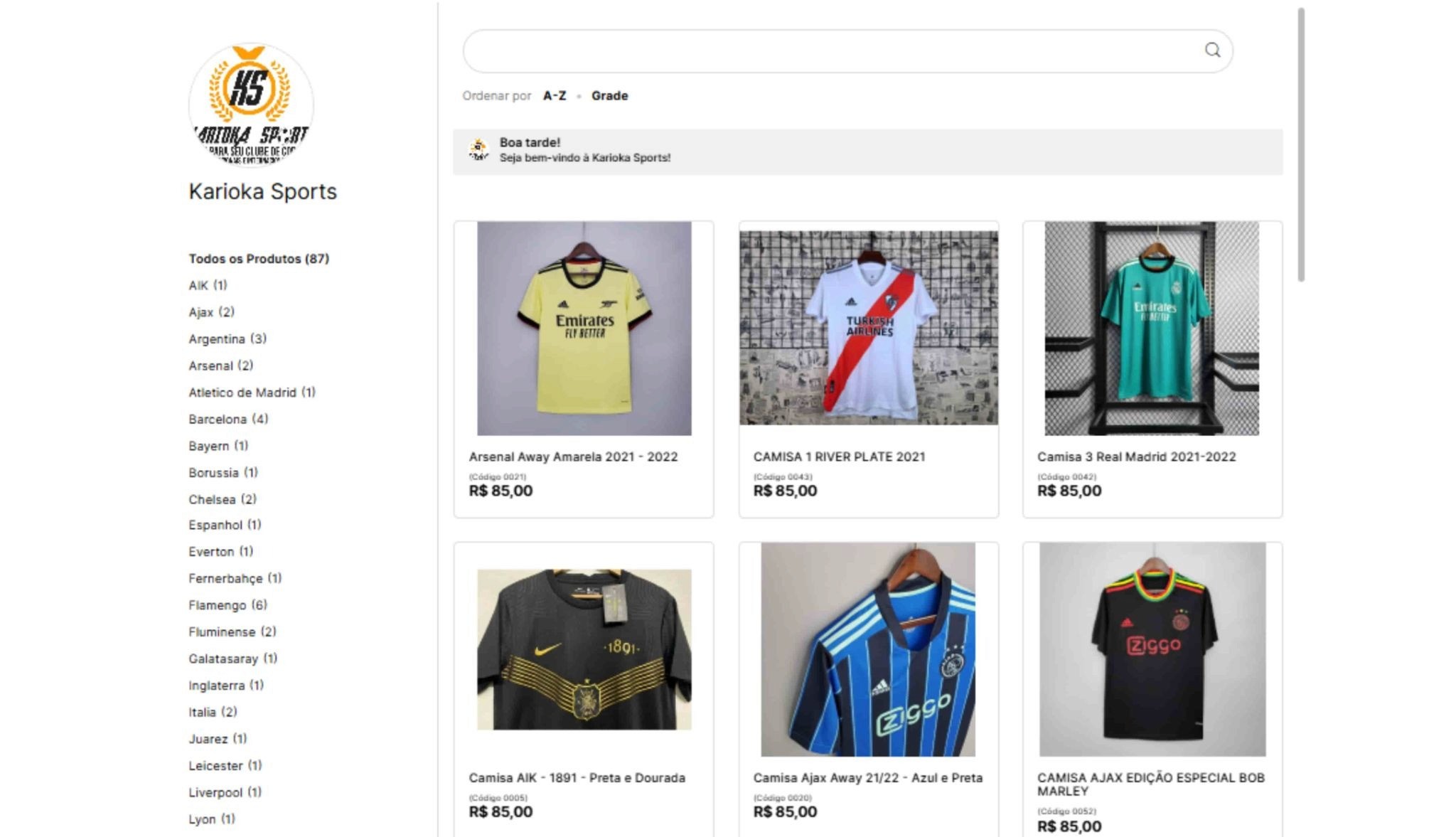 Catálogo online da loja Karioka Sports exibindo grade de camisas de futebol com preços, barra de busca e menu lateral de categorias por clubes e seleções.