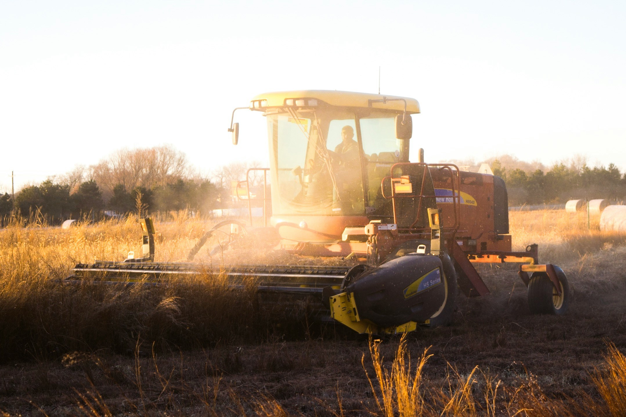 A background image of a farming tractor