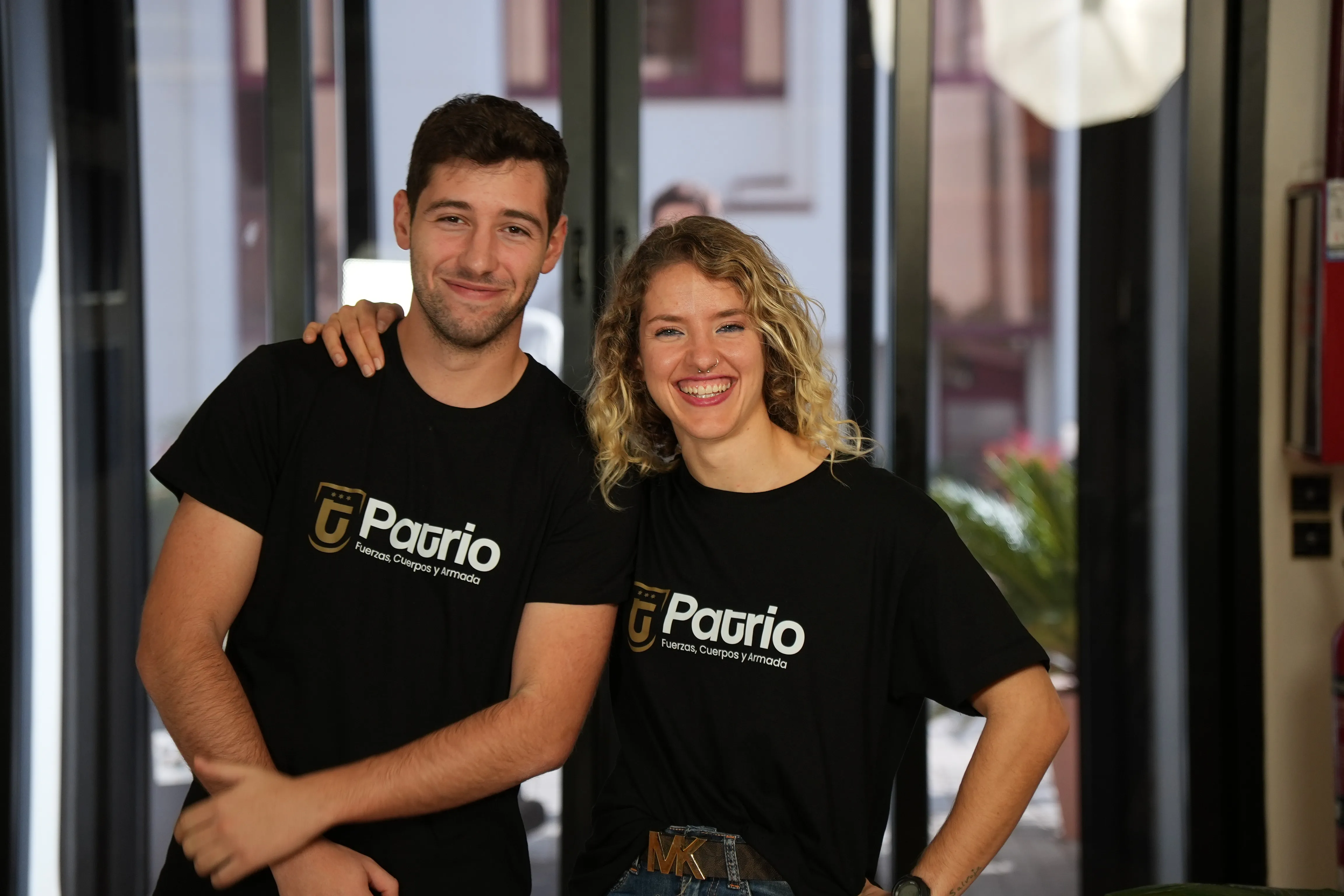 Unique concrete and earth-covered building entrance in a dry, sunny landscape.