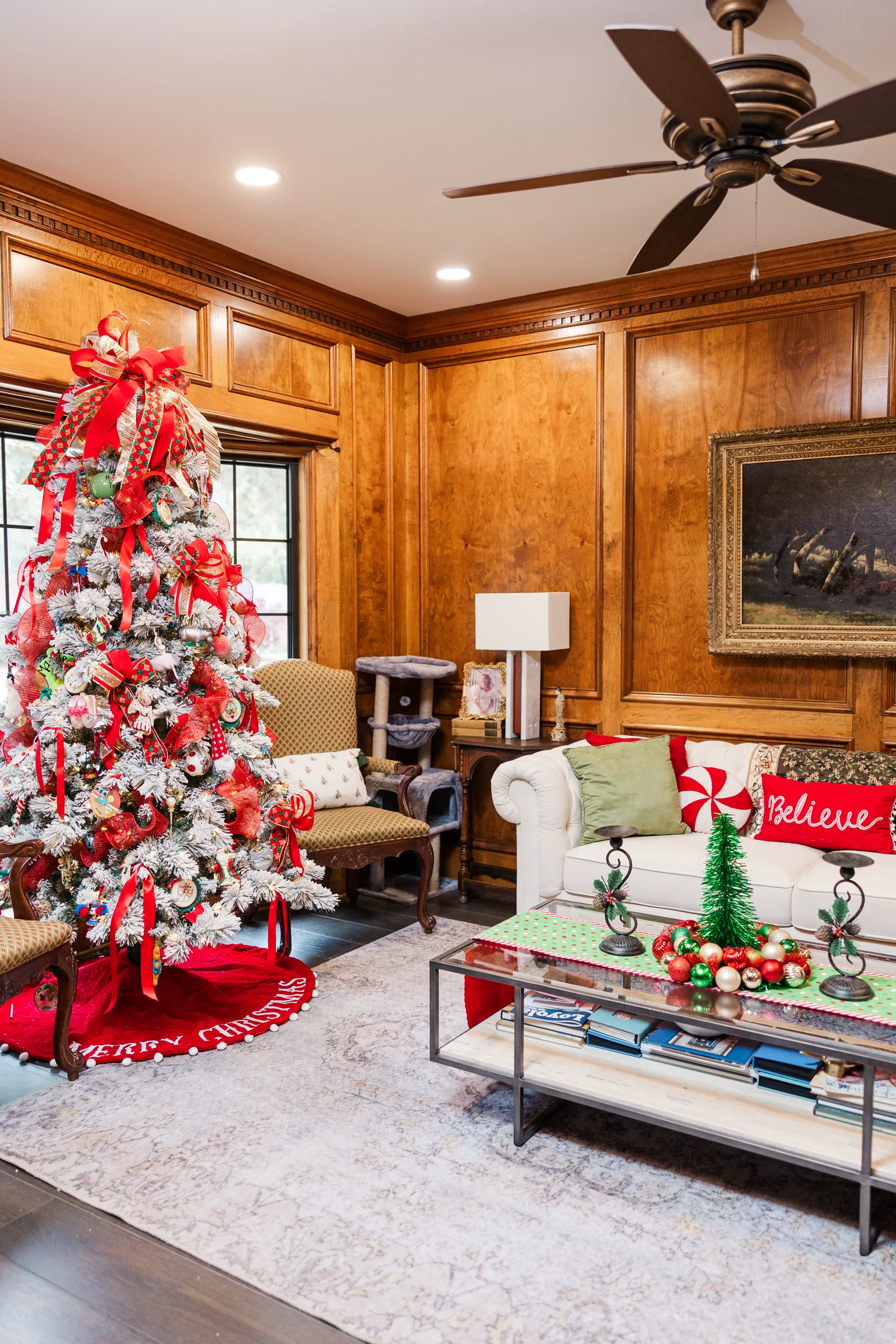 Luxury table setting by Sarah Overall Events with pink embroidered napkins, gold-rimmed plates, floral arrangements, and personalized menus in Shreveport.