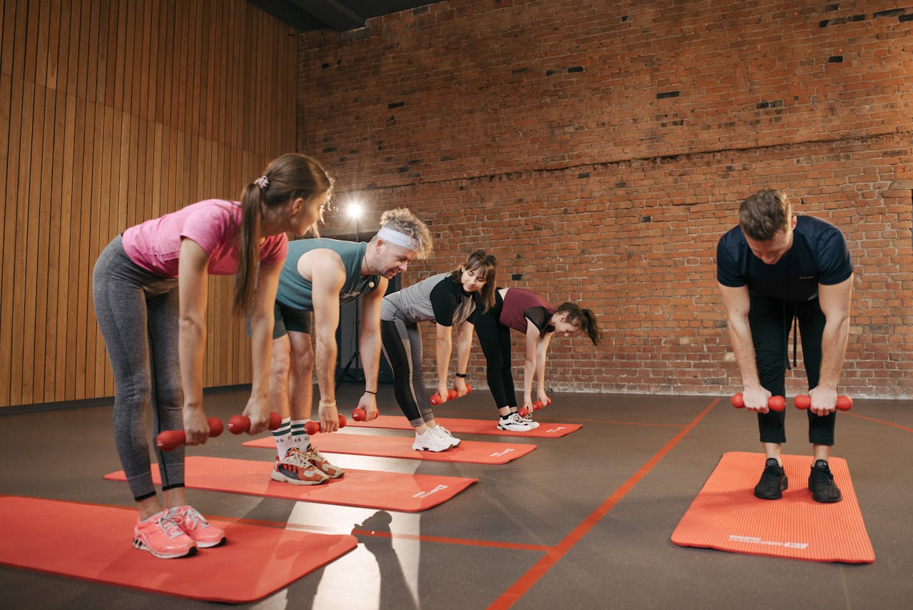 People Practicing Yoga Inside the Studio
