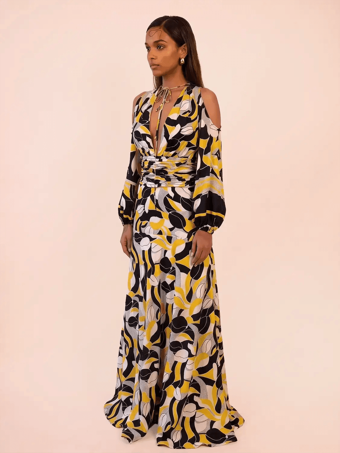 TAARA III Dress is a one of a kind piece, handcrafted in house from pure silk. Designed with a deep V neckline and button down front, it features a fitted waist that shapes the body. 