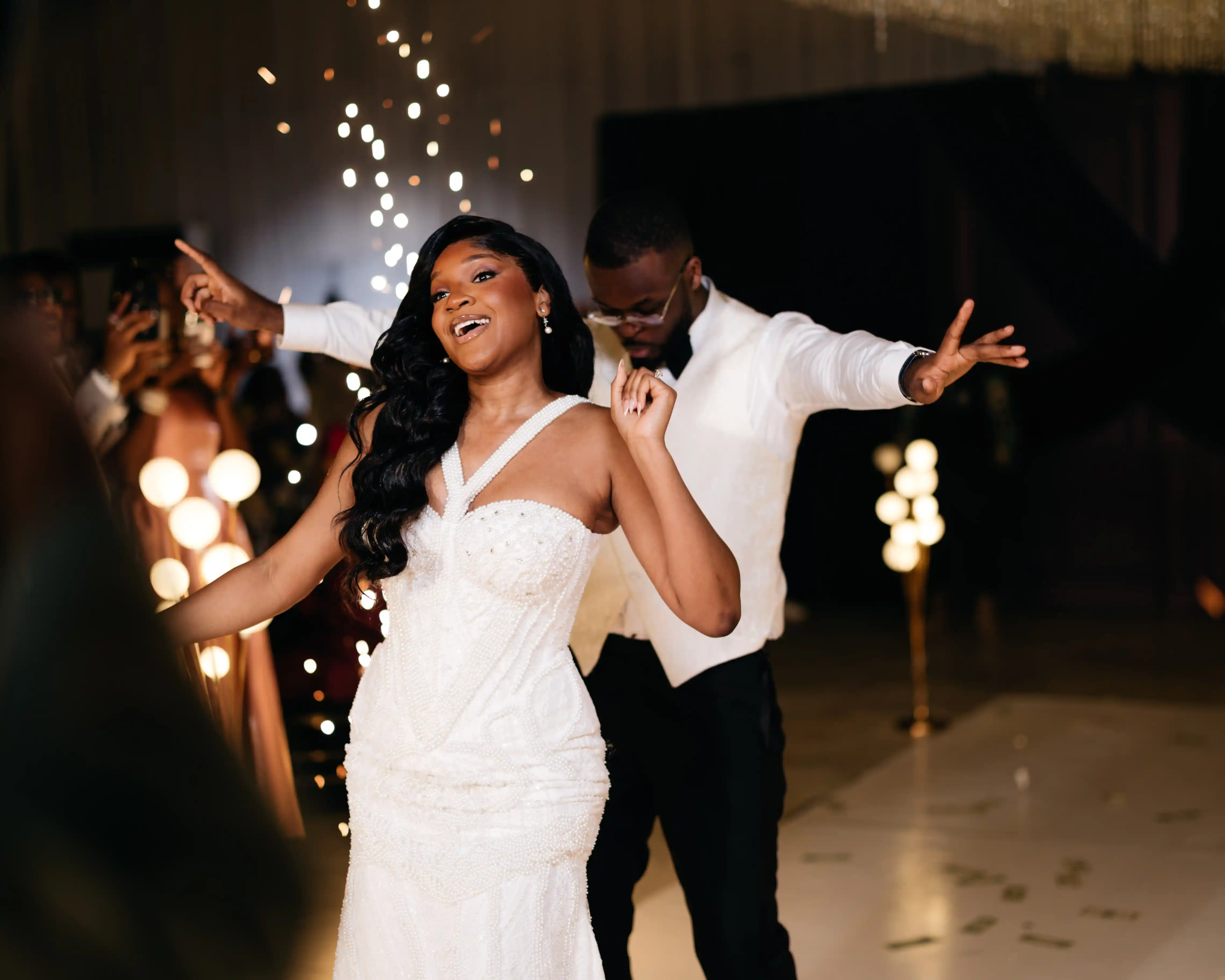 Bride and groom celebrating a luxury wedding coordinated by Victoria Brooks Events, a premium wedding planner in Nigeria.
